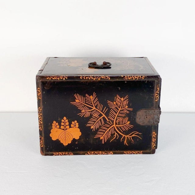 A Japanese lacquered three-drawer trunk, circa 1910.