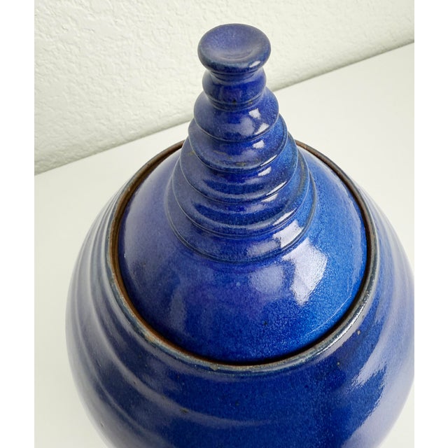 Postmodern, Memphis inspired ceramic earthenware lidded pot or canister featuring a rich cobalt blue glaze and ribbed...