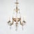 This early 20th-century six-arm Rococo-style gilt bronze and crystal chandelier features porcelain plaques inspired by the...