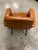 armchair designed in 1960s Italy. Structure in black lacquered metal and upholstered in original tan leather