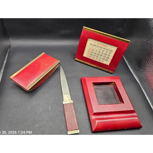 This vintage 1940s desk accessory set is created in gorgeous burgundy leather with brass trim. Photos have been lightened...