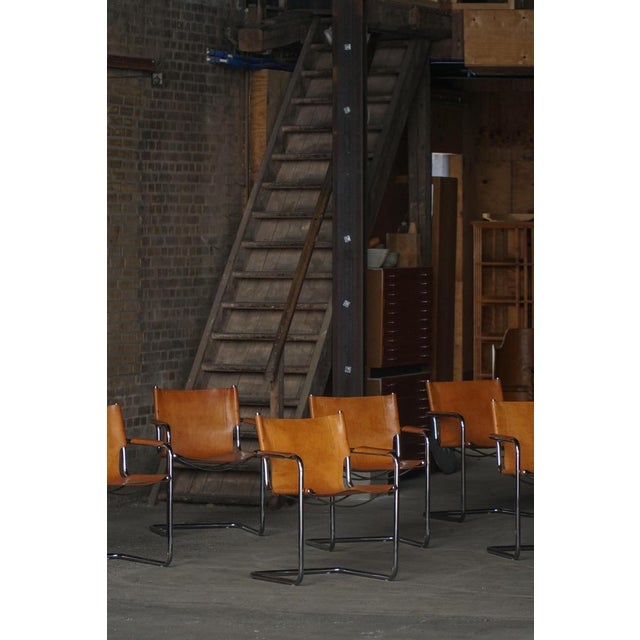 A set of six mg15 cantilever chairs produced by the italian manufacturer matteo grassi. The mg15 model is matteo grassi’s...