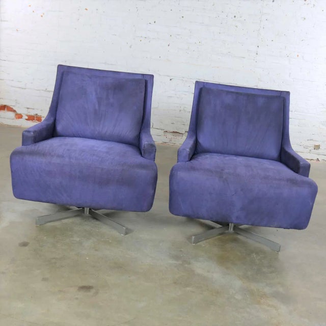Handsome pair of Scoop swivel lounge chairs with a metal base by Barbara Barry for HBF. This pair is in wonderful vintage...