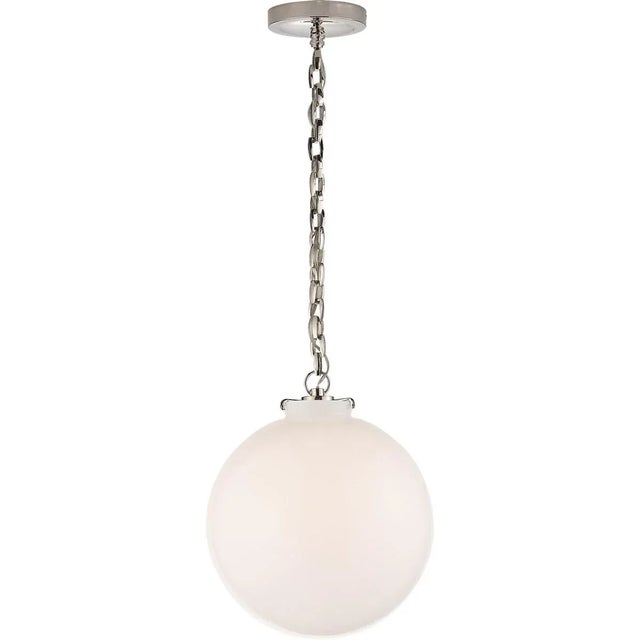 Katie Globe Pendant in Polished Nickel with White Glass Designer: Thomas O'Brien Canopy: 5.25" Round Mounting: Chain Shade...
