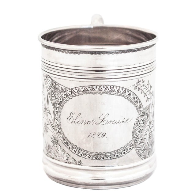Being offered is a sterling silver mug by J. B. & S. M. Knowles of Providence, Rhode Island. Engraved “Elinor Louise 1879”...