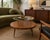 Elegant mid-century modern cocktail table by James-Philip Co. of Paterson, New Jersey, featuring a suspended circular...