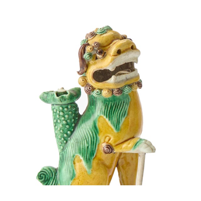 Sancai Guardians: Pair of Chinese Kangxi Biscuit Porcelain Fu Lions 1700-1710 A vibrant and expressive pair of Chinese...