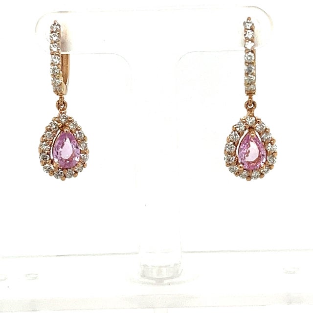 These earrings have Pear Cut Pink Sapphires that weigh 1.68 carats and measure at approximately 7 mm x 5 mm. There are...