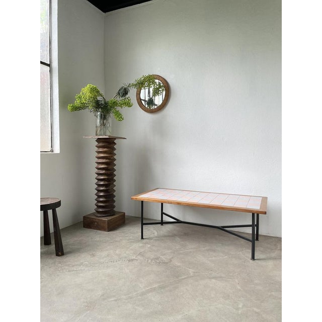 Old coffee table from the 50s composed of a top with its oak surround and the interior composed of blue and pink ceramic...