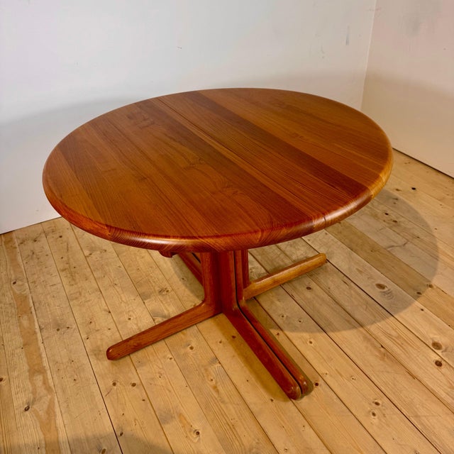 Extending round teak dining table, 1960s