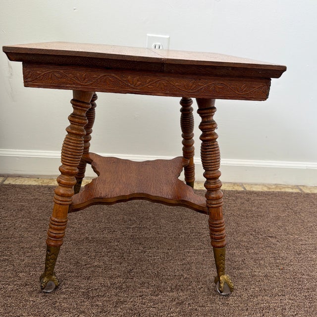 Bring classic late-Victorian charm to your space with this beautiful, two-tier American solid oak parlor table dating back...