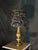 One-of-a-kind table lamp featuring an ornate antique gold-tone base with a dramatic black sculptural textured shade. The...