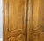 Vintage Louis XVI French Oak Four Door Carved Armoire For Sale - Image 5 of 11