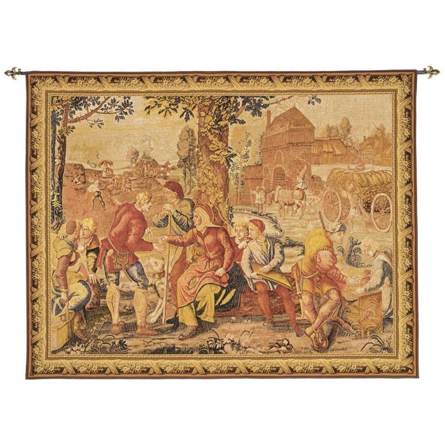 An early 16th Century tapestry from Flanders representing the month of August. Peasant folk are receiving wages for their...