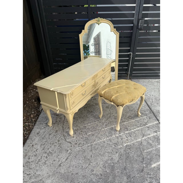Beautiful French provincial style vanity set includes small dresser mirror, which hangs above and a stool circuit 1960,...