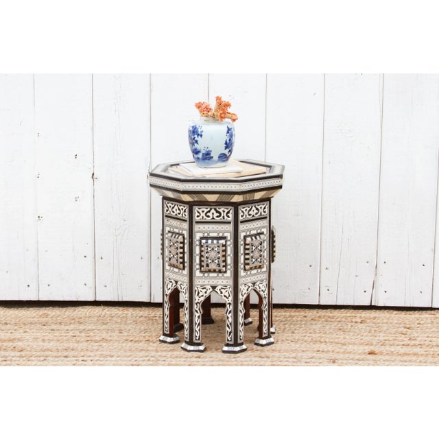 Masterfully constructed, this vintage exotic side table boasts splendid marquetry inlaid work using mother of pearl. The...
