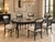 A striking vintage Chinoiserie dining table featuring a sculptural faux-bamboo frame finished in high-gloss black lacquer,...