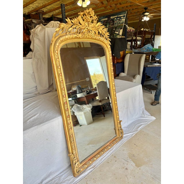Found in the South of France, this large scale 19th Century French Giltwood Wall Mirror was crafted in the late 1800's in...