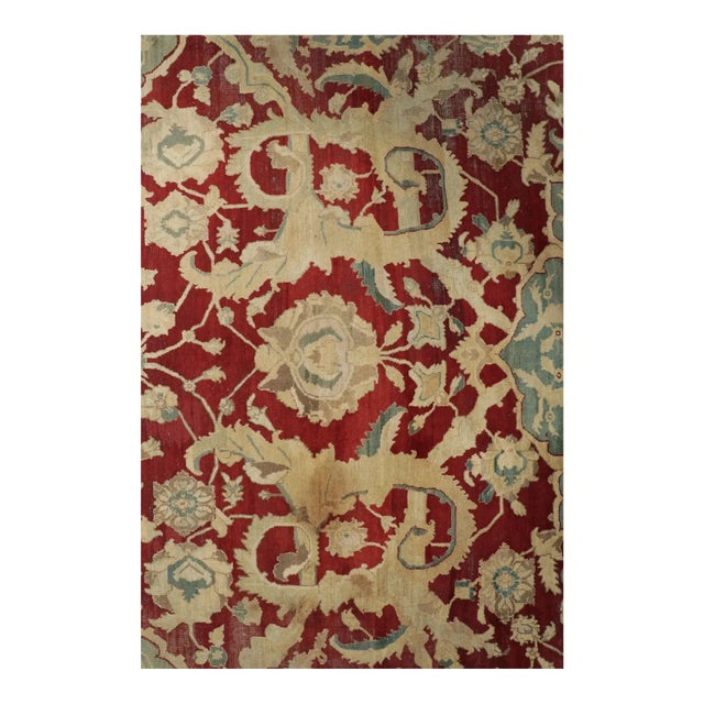 Made with hand-knotted wool, circa 1920-1929, and originating from India, this oversized 15x16 antique Agra rug is an...