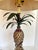 Here is a charming table lamp featuring a figurative pineapple in the center. The lamp is made from tole metal on the...