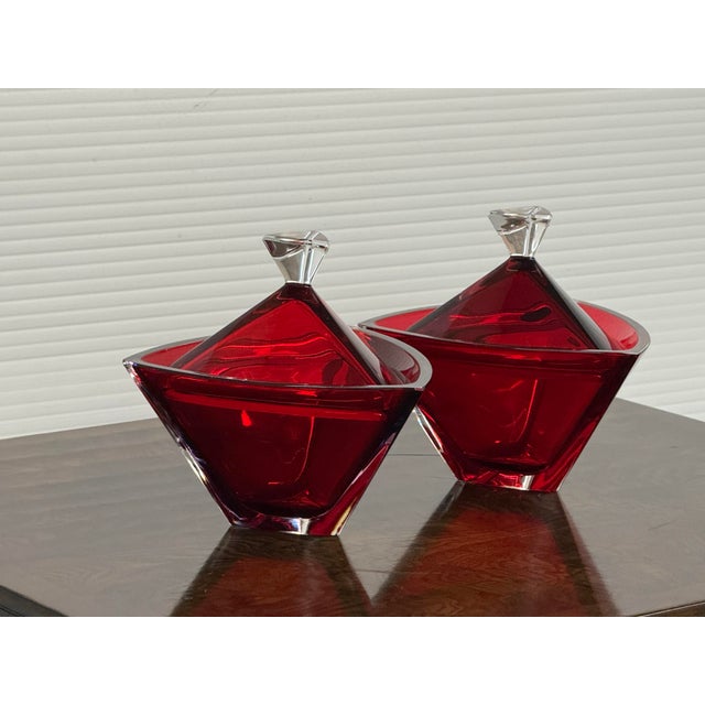Design Plus Gallery presents a Pair of Lidded Geometrically Shaped Bowls from Bohemia Crystal. They are vibrant with a...