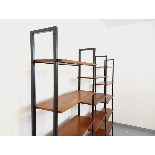 Vintage modular Scandinavian-style bookcase from the 1960s, in 3 sections, Italian design, made of teak and black metal,...