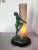 Re-Edition of the Frankart F612 Lamp with a pink glass Shade featuring a nude flapper dancer