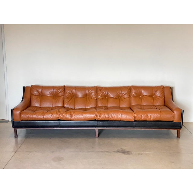 1960s sofa, the style recalls that of Claudio Salocchi, 4 seats, cognac-coloured imitation leather cushions, black...
