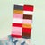 Iqi Qoror's surreal figurative paintings are arresting in their earthy palettes offset by pops of fluorescent textile...