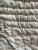 This is a beautifully hand sewn quilt. The flowery details make such an adorable cottagecore collectible. And the scallop...
