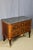 18th-century marquetry commode from the Transition period. This commode opens with two drawers and rests on four slightly...