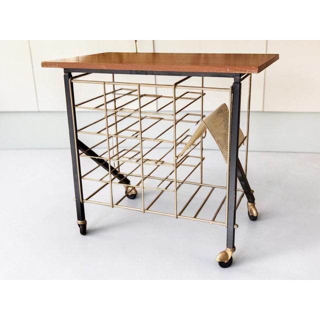 Vinyl record storage side table, labeled L'Or Fin. Black and gold lacquered metal frame. L'Or Fin was a French furniture...