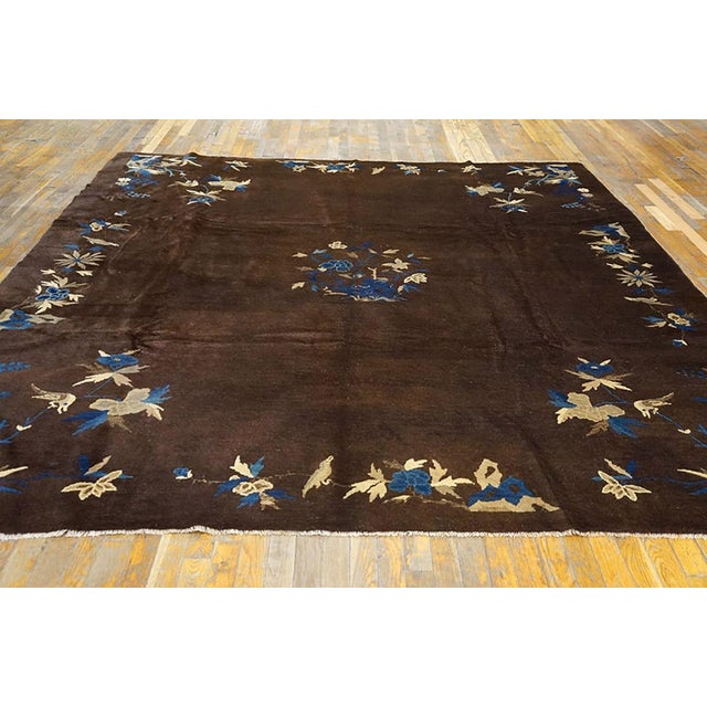 Antique Chinese, Peking rug With dark brown background, floral border. Size: 8'2" x 9'5". Antique Floral Medallion Wool...