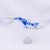 This artwork features a delicately crafted fish, rendered in resin cast with vibrant acrylic gouache detailing. The...