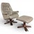 A classic Swedish Stressless leather recliner with its matching footstool, combining ergonomic comfort with a sculpted...