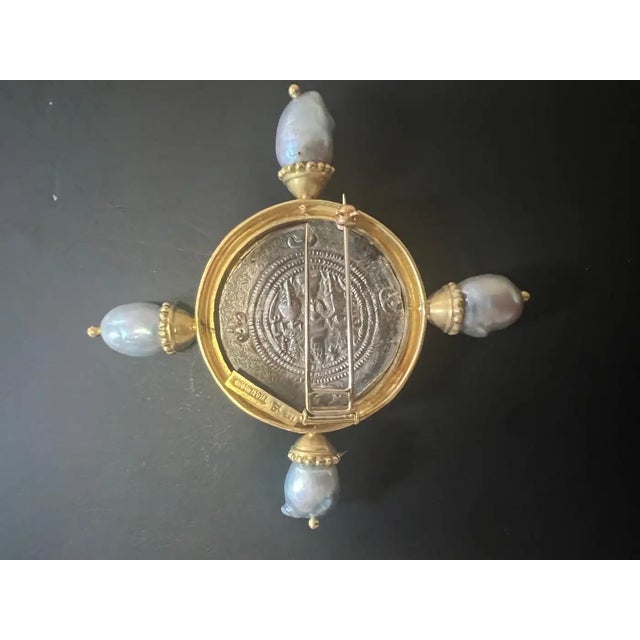 A rare and exquisite brooch by legendary designer Elizabeth Locke, showcasing a Silver Sasanian Coin depicting Xusro I...