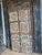 A striking architectural statement piece with serious character. This single barn door showcases hand-carved detailing...