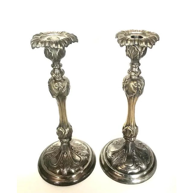 Vintage pair of silver-plate candlesticks circa 1940 with a reprosese art nouveau design. Silver over heavy brass a tall...