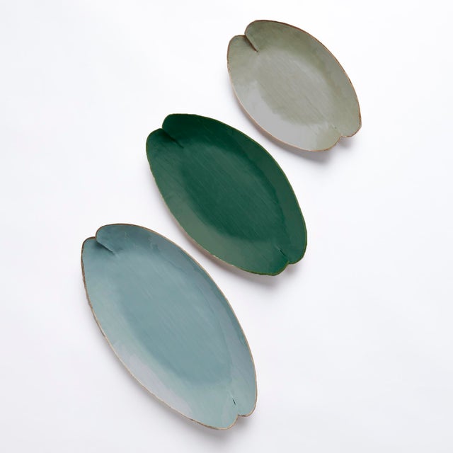 This charming set of handpainted decorative trays are inspired by lily pads. With aGold edge detail, and coordinating...