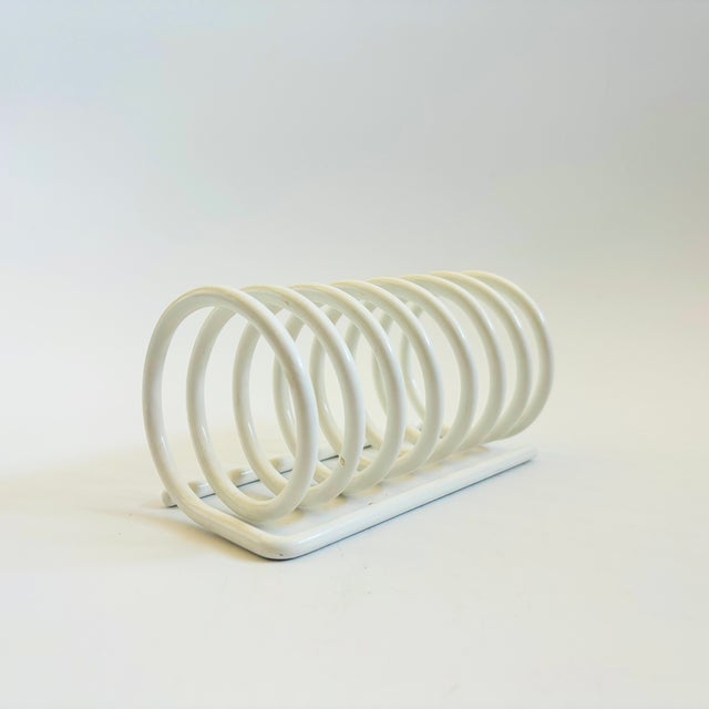 A wonderful vintage metal coil letter holder. White coated metal finish. Perfect for using as a paper or mail organizer....