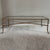 Fabulous vintage Italian Hollywood Regency style faux bamboo gilt metal coffee table with glass top inset. Measures 48” w...