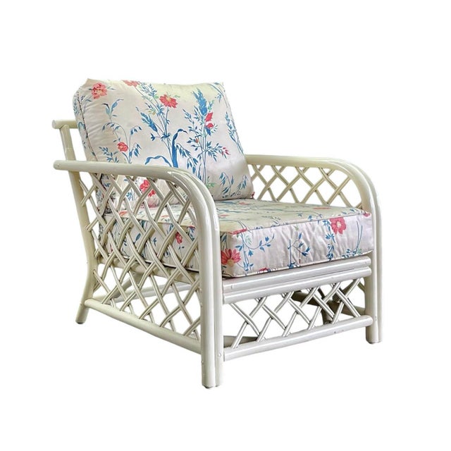 A fantastic pair of 1960s Chinese Chippendale style rattan lounge chairs attributed to Ficks Reed in a classic lattice...