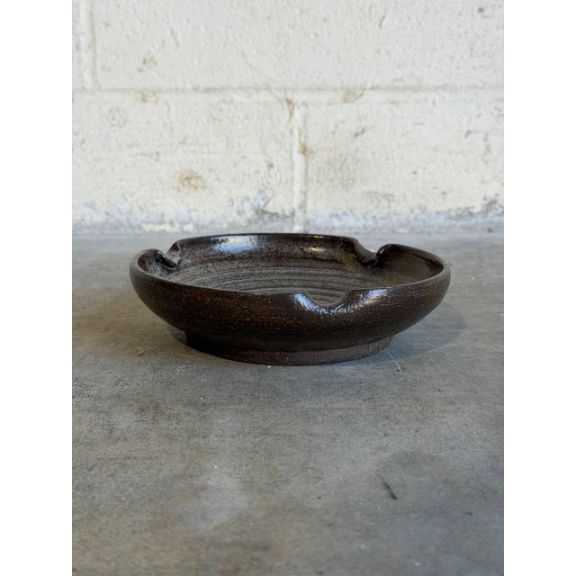 This wheel-thrown studio pottery piece functions beautifully as either a substantial ashtray or a rustic trinket dish....