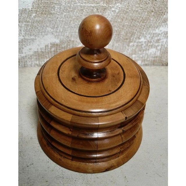 A Fine Georgian Dutch Tobacco Jar. Made from Walnut & Fruit wood, this ring turned Jar has a turned stepped body and base,...