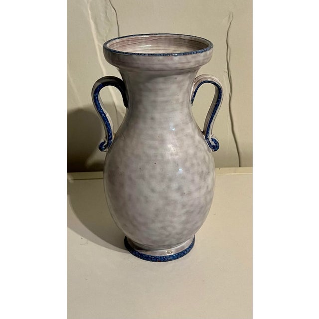 This pretty, one of a kind, blue and white loving cup vase is the perfect size for single clipping from your garden....
