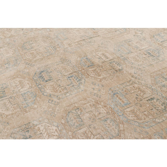 Hand-knotted wool and originating from Turkey circa 1950-1960, this 9x11 vintage Ersari rug is from the same provenance, a...