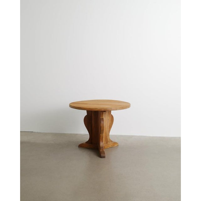 A very rare and early Swedish mid century modern "Lovö" side / console center table with a traditionally sculptural base...