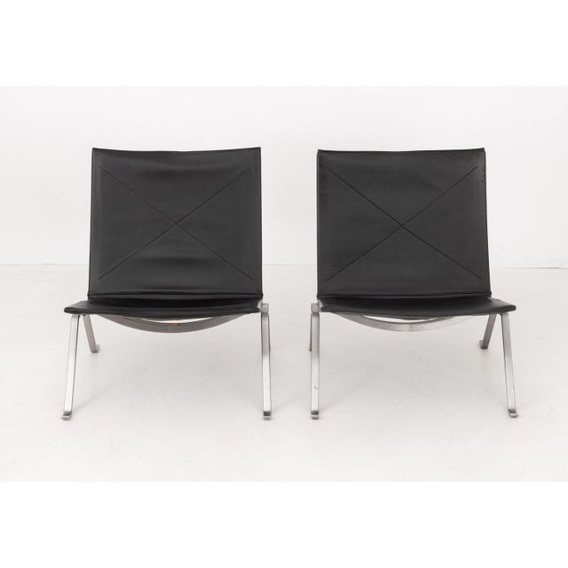 After Poul Kjaerholm (Danish, 1929-1980) for Fritz Hansen Pair of "PK22" Lounge Chairs, 2005-2007, with black leather...