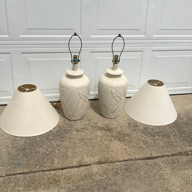 Wonderful pair of cream plaster palm tree or banana leaf lamps, circa 1980s. These lovely tropical style lamps are made...