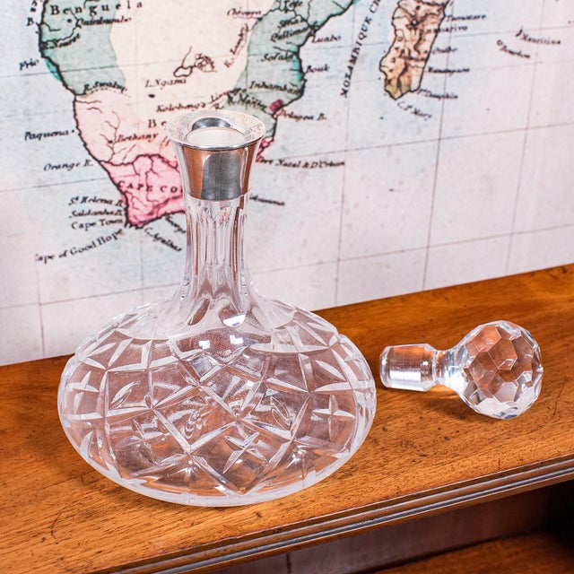 This is a vintage full bodied red wine decanter. An English, cut glass Cabernet or Rioja bottle with hallmarked silver...